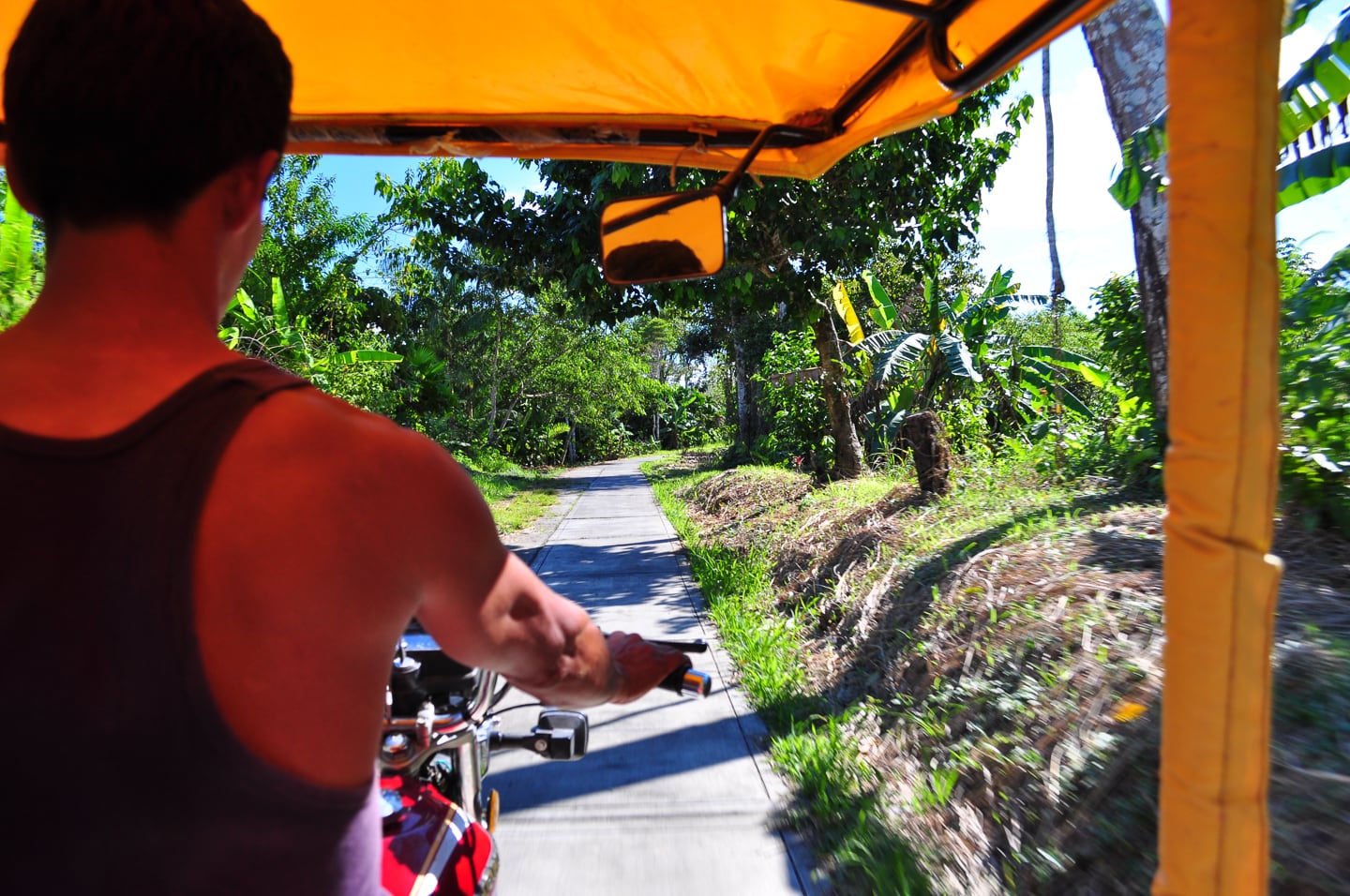 man driving Tuk Tuk