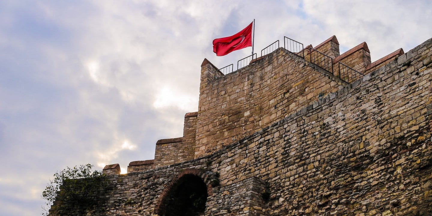 flag atop old rampart istanbul walls turkey