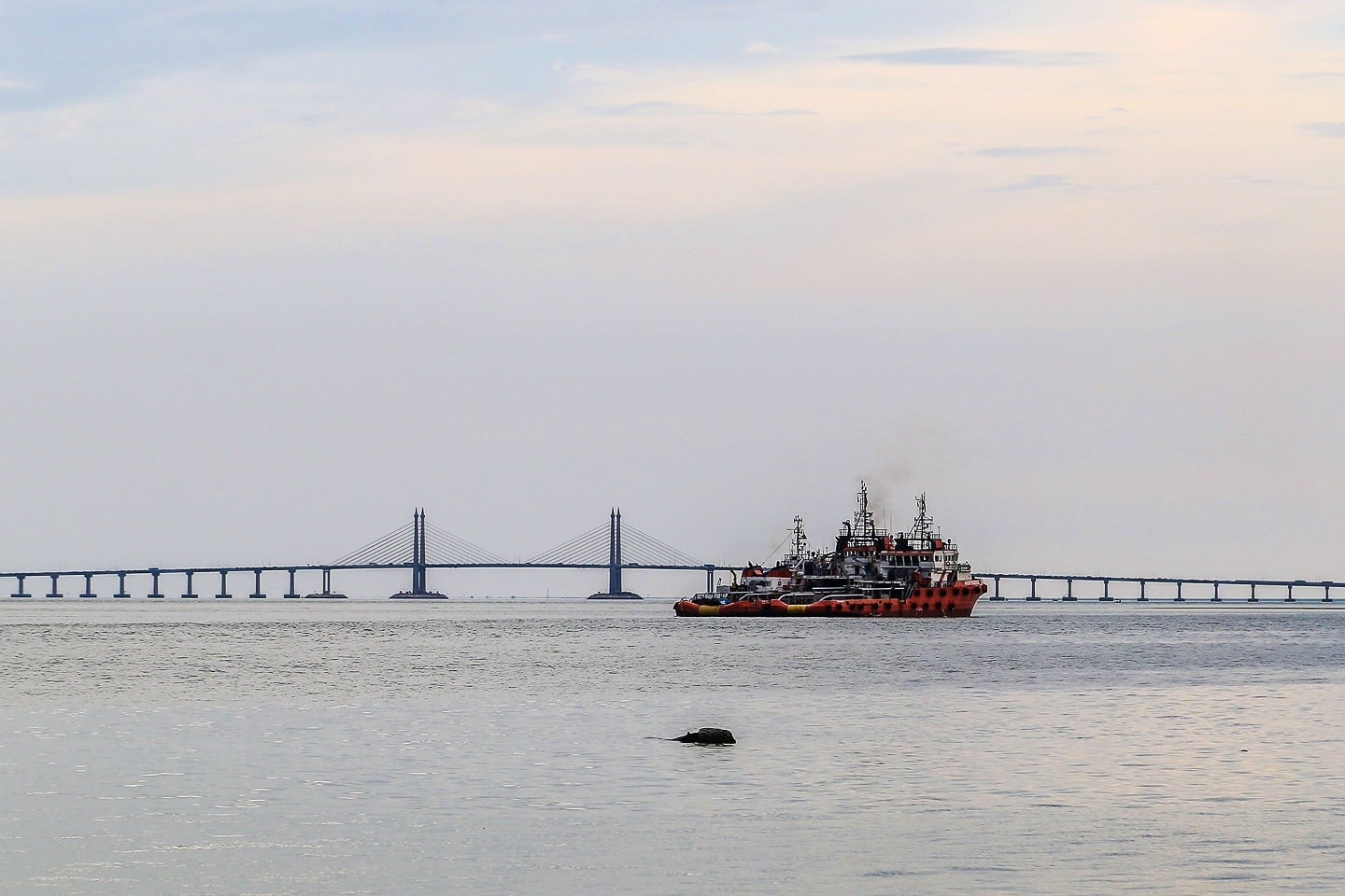 boat and bridge in George Town Malaysia