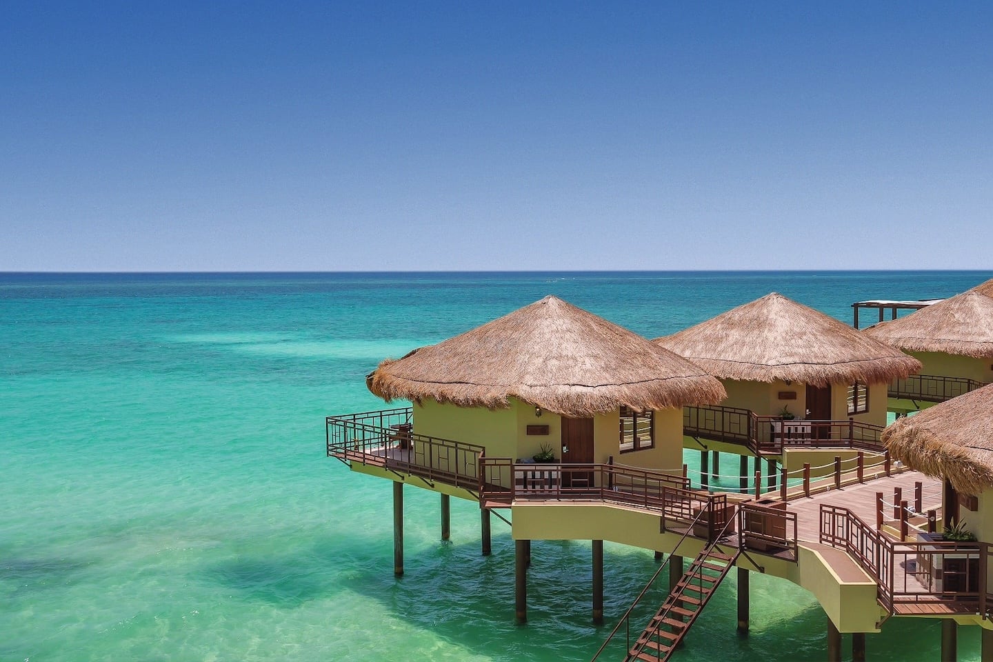 bungalows over water on Riviera Maya