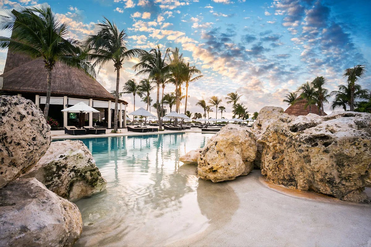 large pool surrounded by rocks at one of the top Mexico adults only all-inclusive resorts