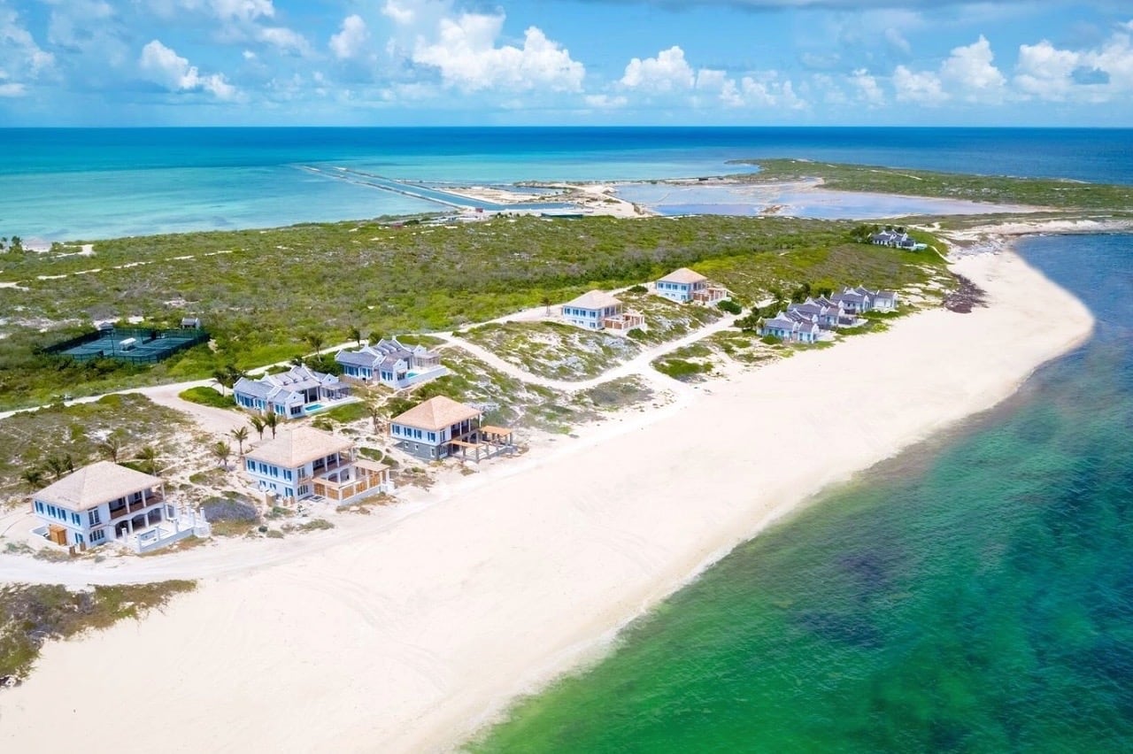 beach lined with large vacation villas