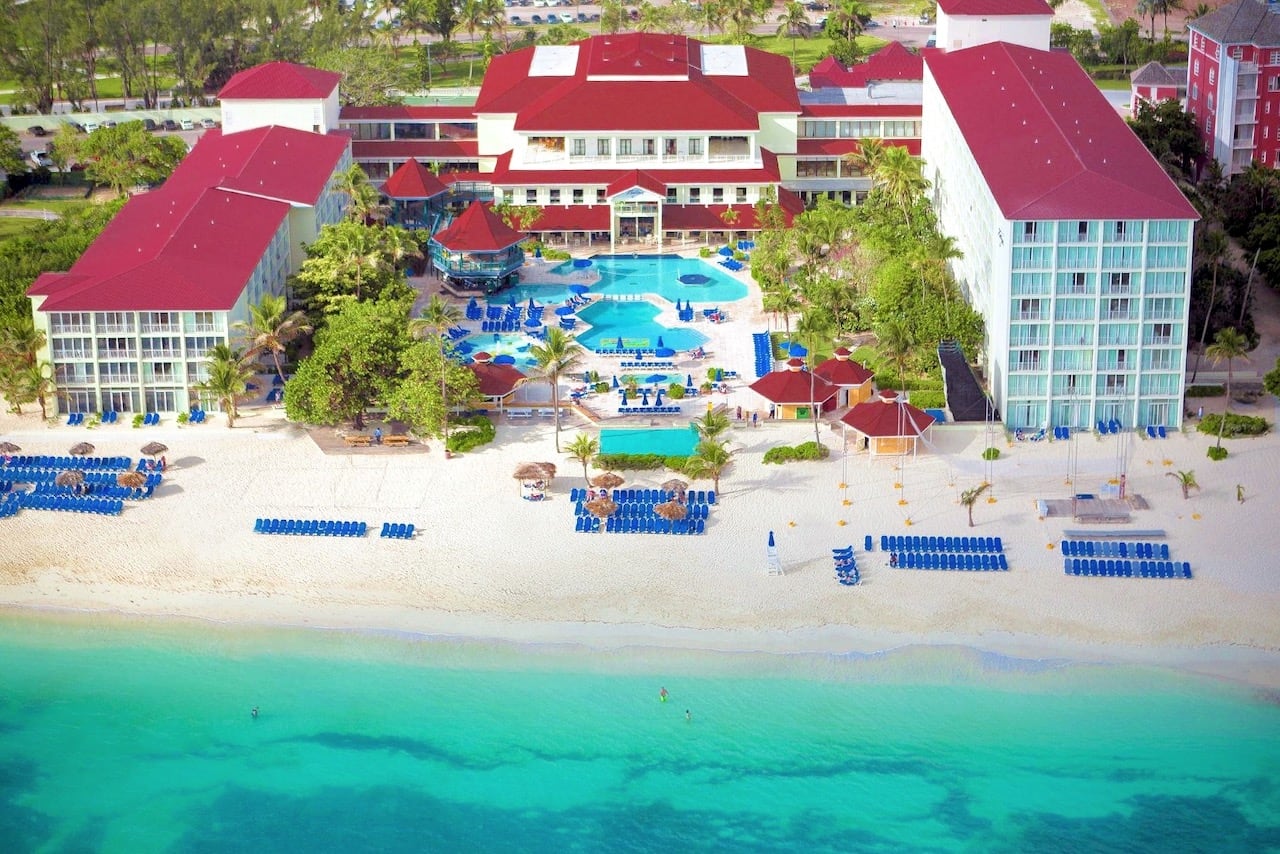 large beach resort with red roof