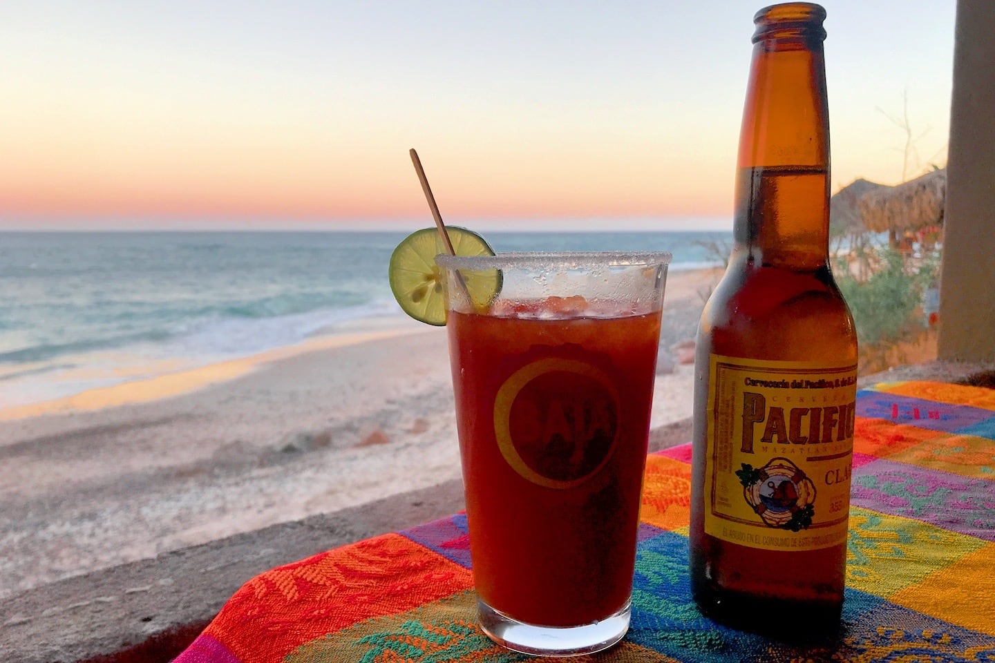 happy hour drinks by the sea at sunset