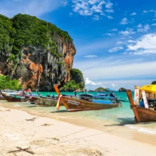 long tail boats on Phra Nang Princess Beach in Railay Beach Krabi Thailand