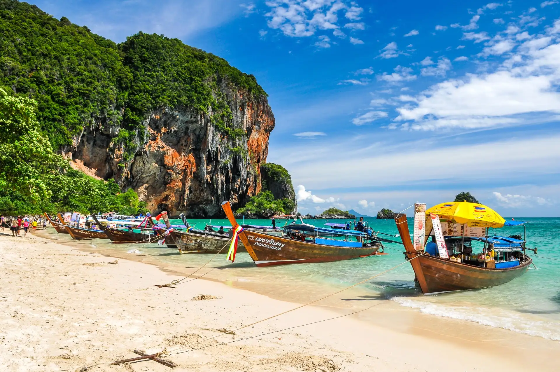 long tail boats on Phra Nang Princess Beach in Railay Beach Krabi Thailand