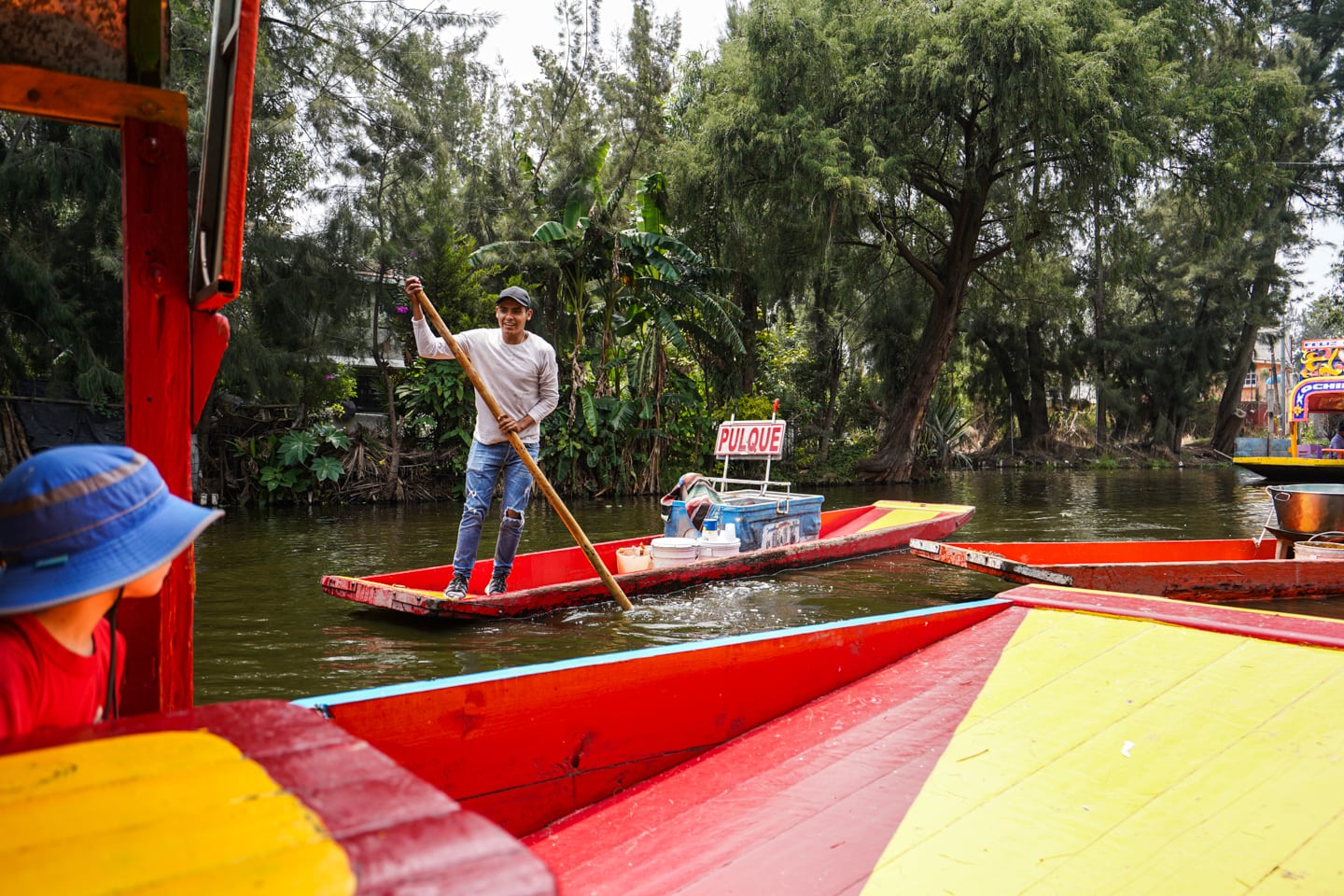 man on gondola selling drinks