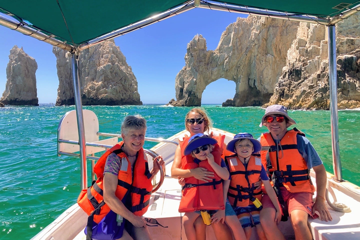 family in boat at Arch of Cabo San Lucas